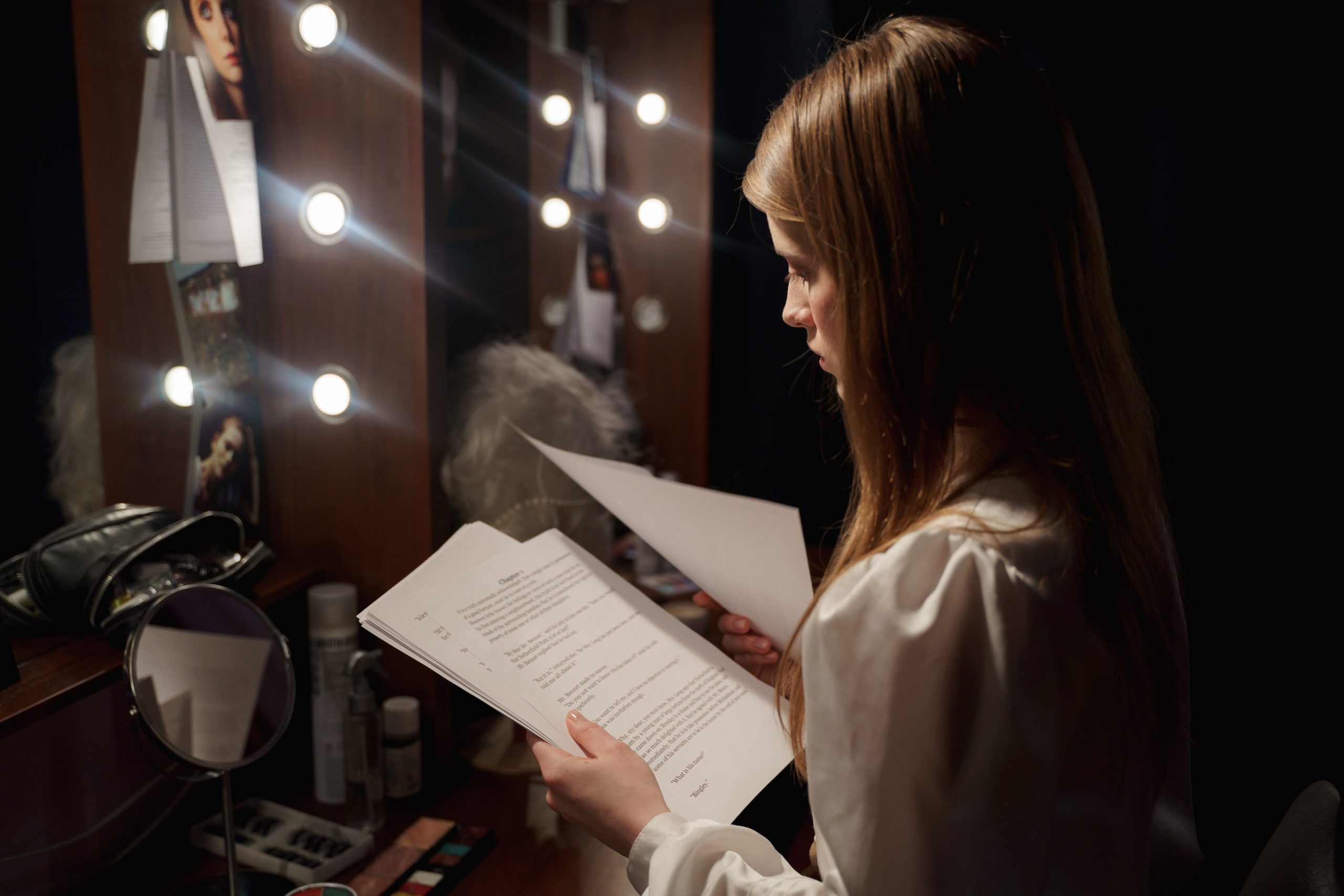 Actor studying a script while practicing memorization techniques to learn lines faster and improve recall before an audition.