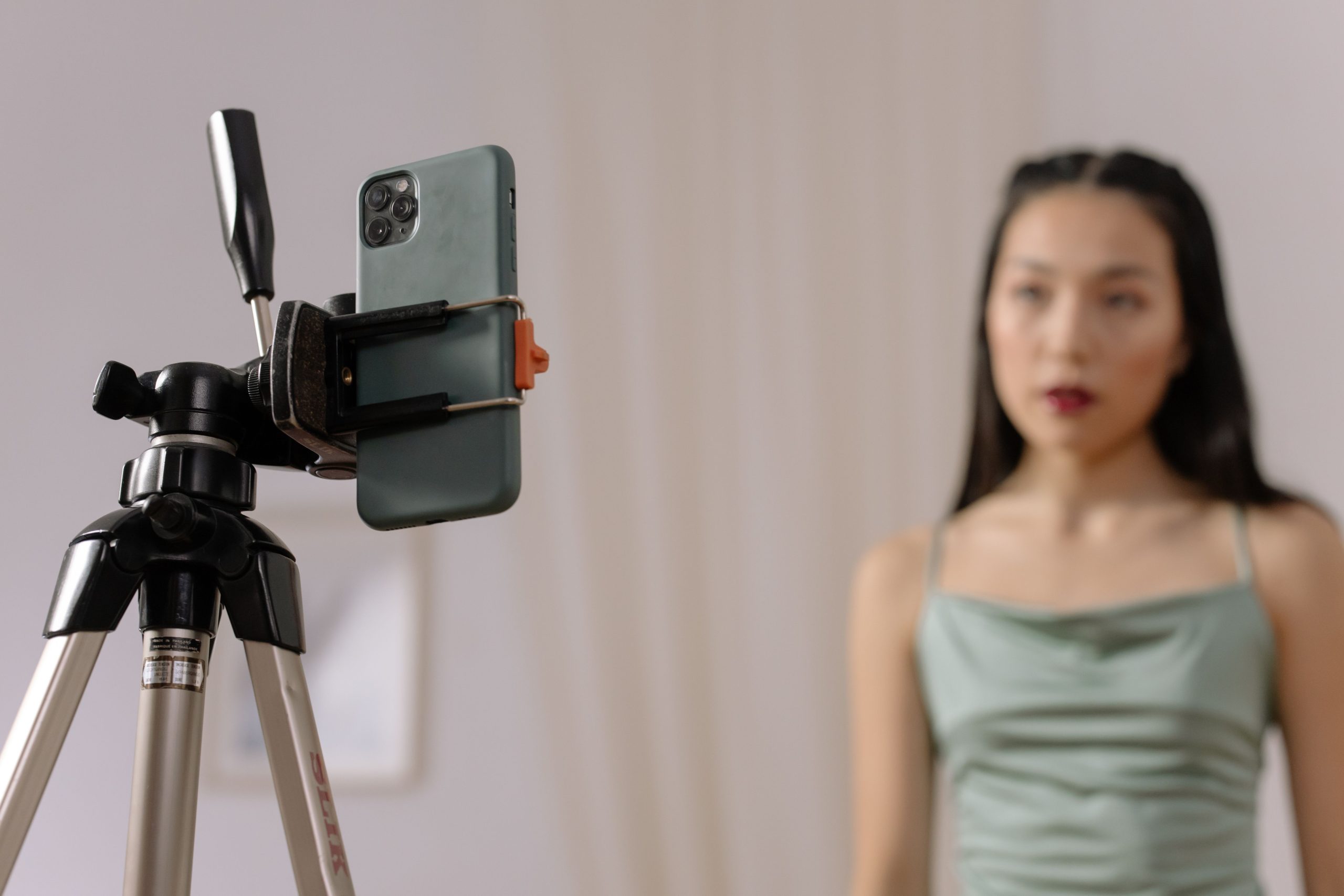 Smartphone mounted on a tripod for a self-tape acting audition.