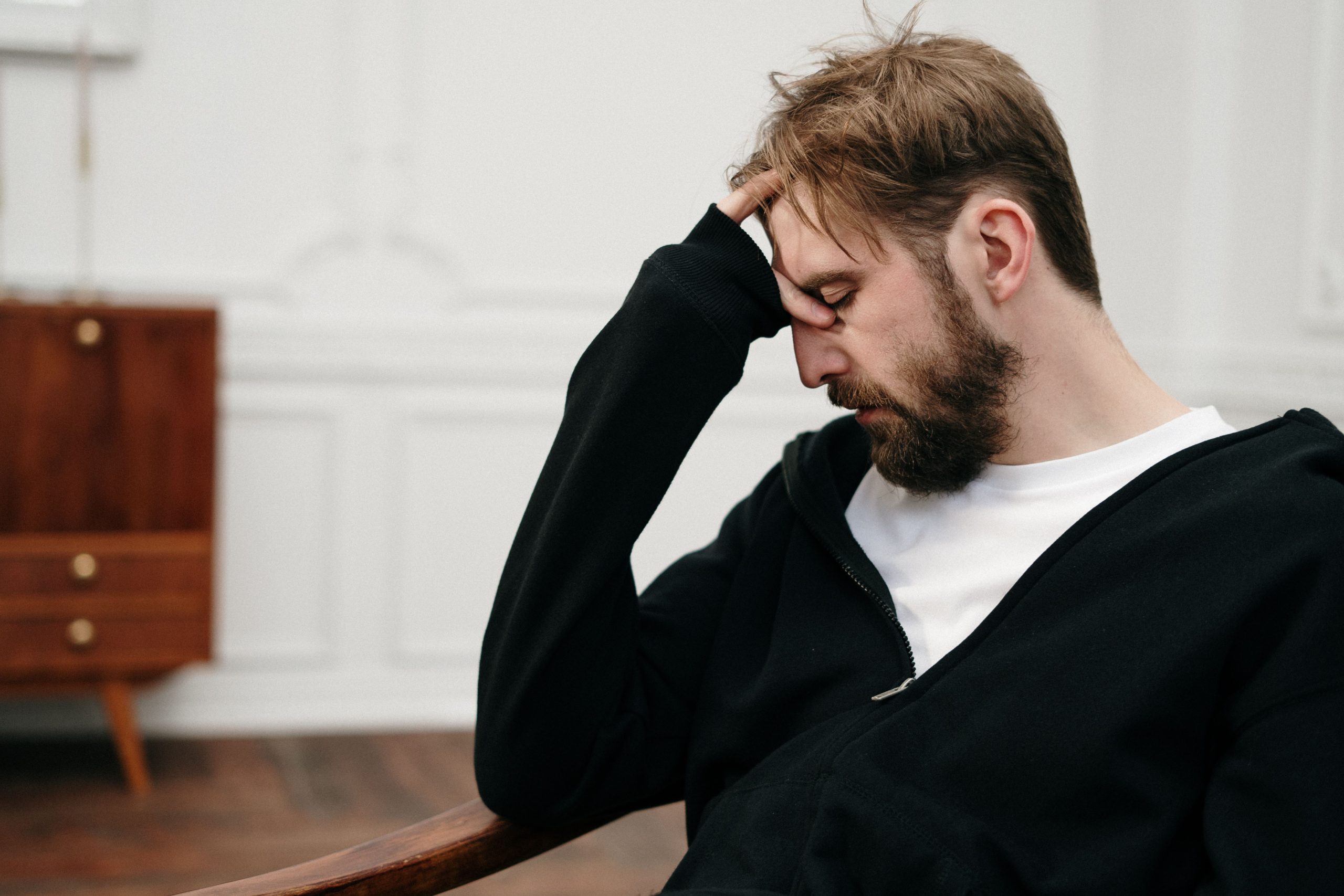 Actor appearing mentally exhausted and reflecting on how to regain motivation.